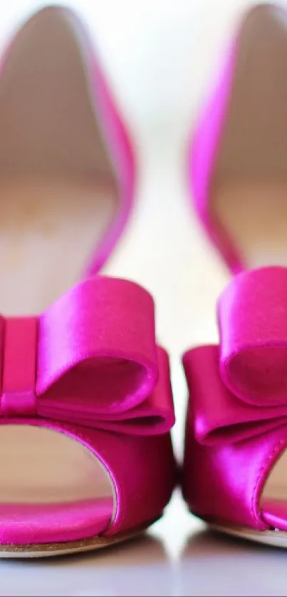 Vibrant pink heels with bows on a soft blurred background.