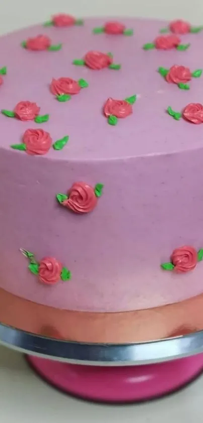 Pink cake with rose decorations, elegant and artistic.