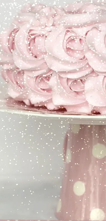 Elegant pink cake with floral icing on a polka dot stand.