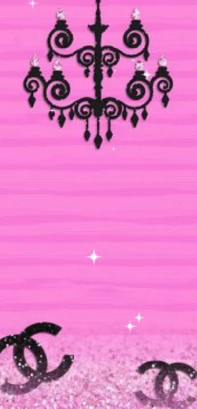 Elegant black chandelier on a vibrant pink mobile wallpaper.