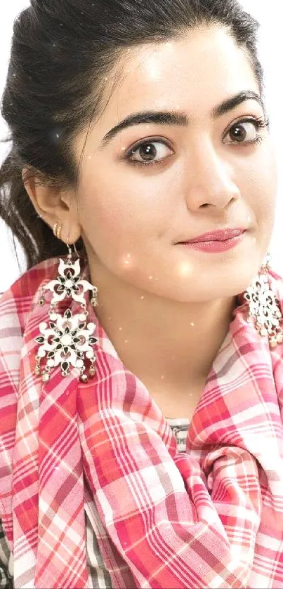 Portrait with pink checkered scarf and elegant accessories.