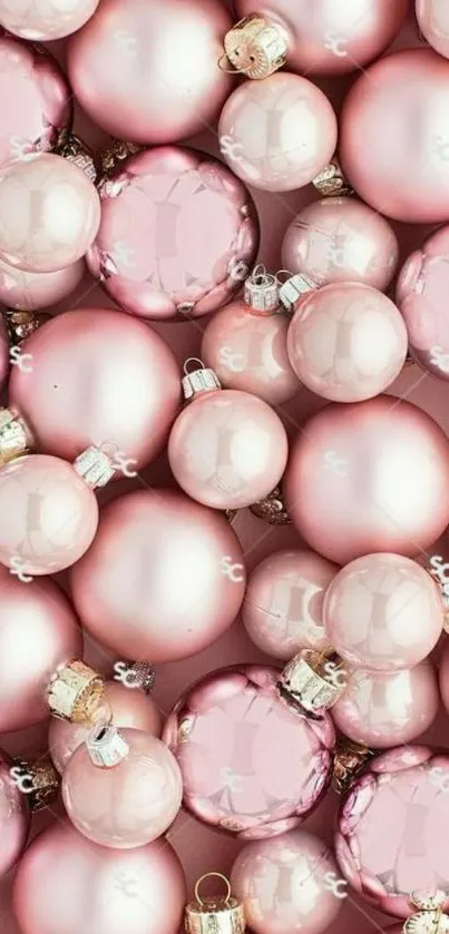 Pink Christmas ornaments mobile wallpaper with elegant festive design.