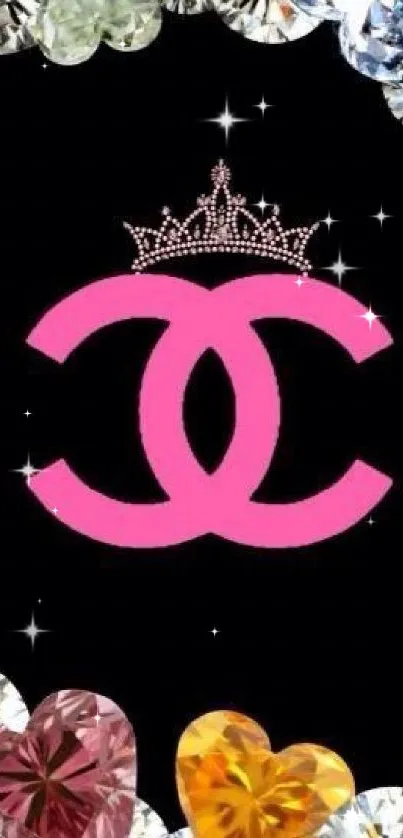 Pink crown and diamonds on black wallpaper.