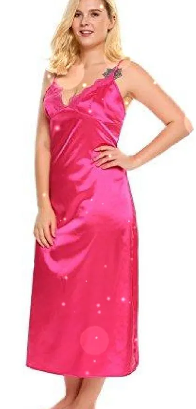 Woman in vibrant pink satin dress standing elegantly.