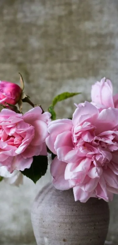 Pink flowers in a rustic vase on a mobile wallpaper.