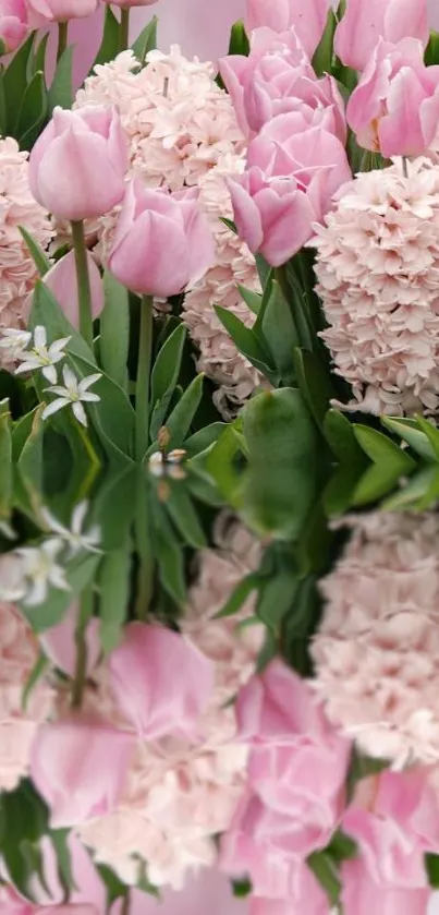 Wallpaper featuring pink tulips and hyacinths with green leaves.