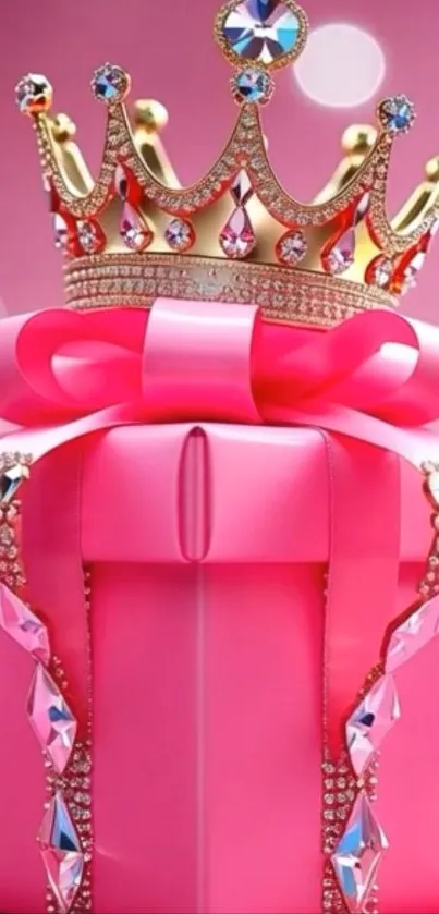 A pink gift box topped with a jeweled crown