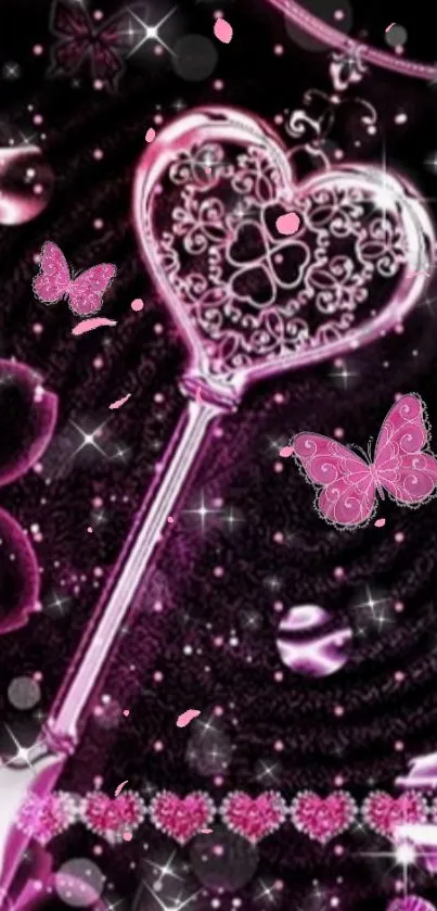 A pink heart-shaped key with butterflies and sparkles on a black background.