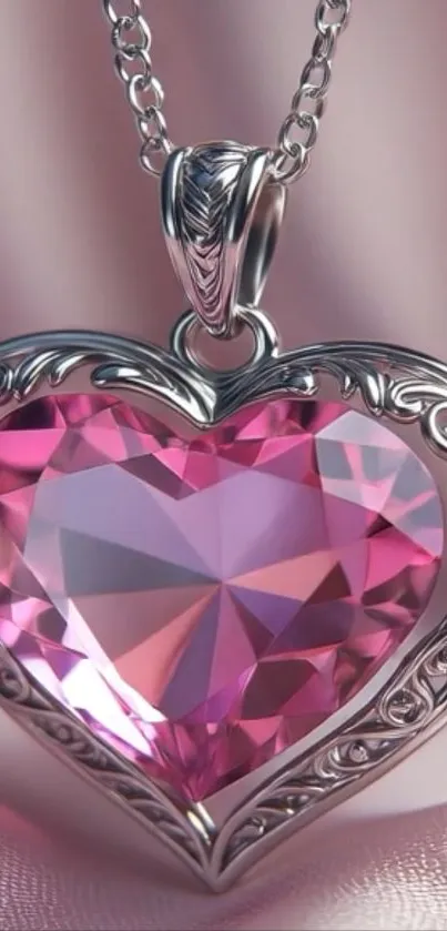 Pink heart pendant with silver chain on soft background.