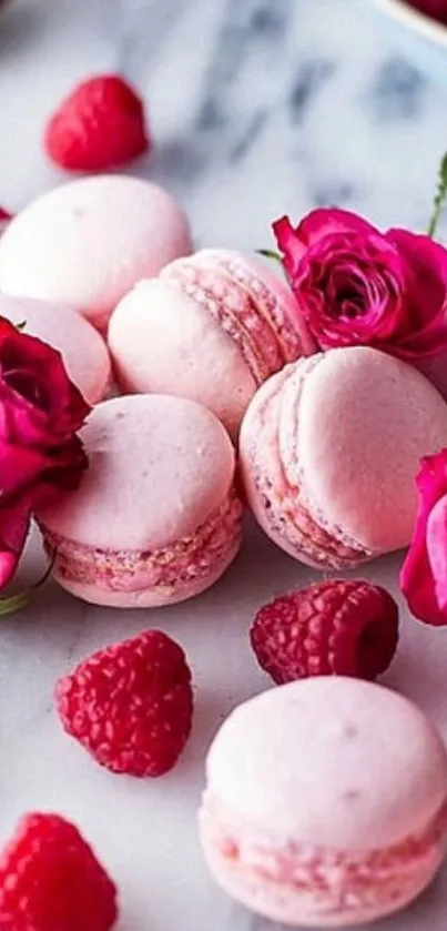 Pink macarons with roses and raspberries.