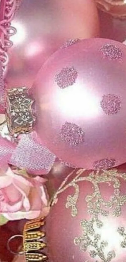 Pink Christmas ornaments with elegant designs.