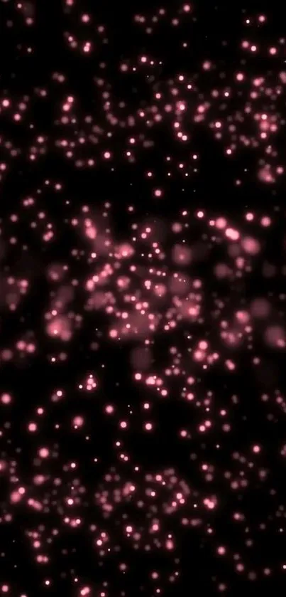 Elegant glowing pink particles on a dark background mobile wallpaper.