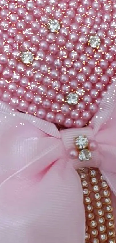 Elegant mobile wallpaper with pink pearls and a bow.