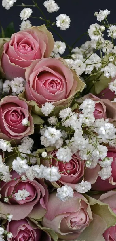 Elegant bouquet of pink roses with delicate white flowers.