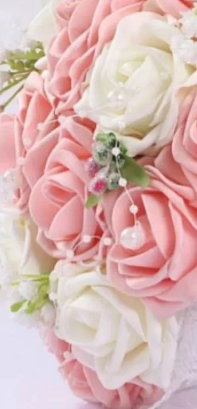 Bouquet of pink and white roses with delicate details on a mobile wallpaper.