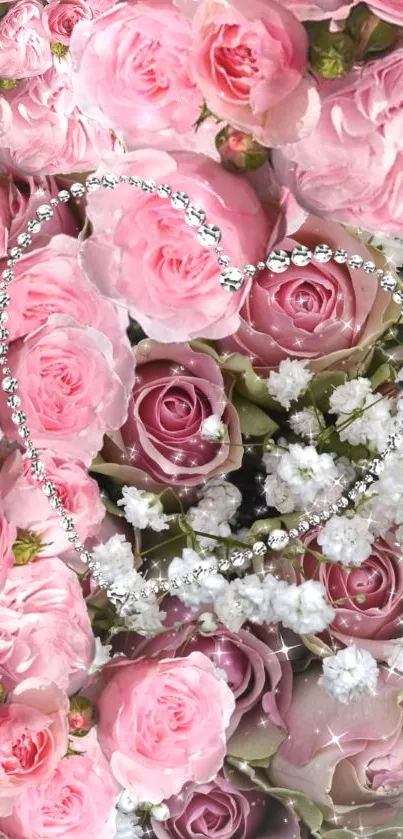 A bouquet of pink roses with white baby's breath flowers.