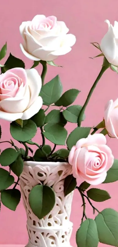 Bouquet of pink and white roses in a decorative vase against a pink background.