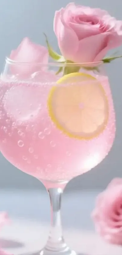 A pink cocktail with a rose garnish and lemon slice in a glass.