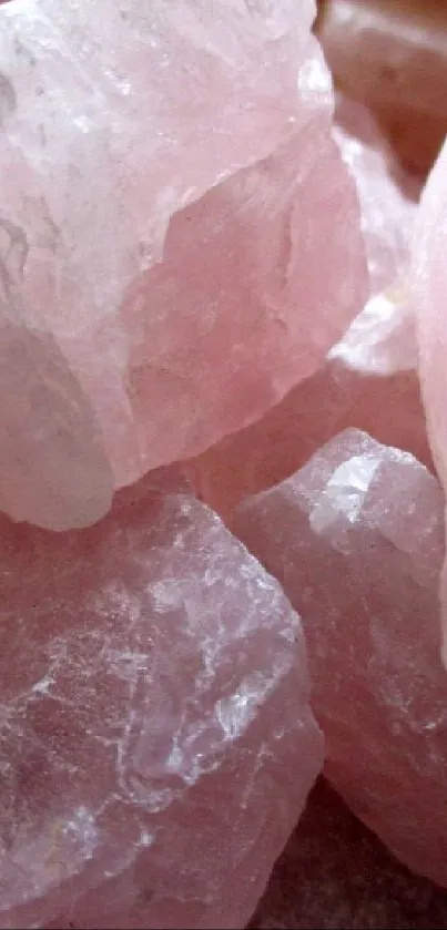 Close-up of pink rose quartz stones for a stylish phone wallpaper.