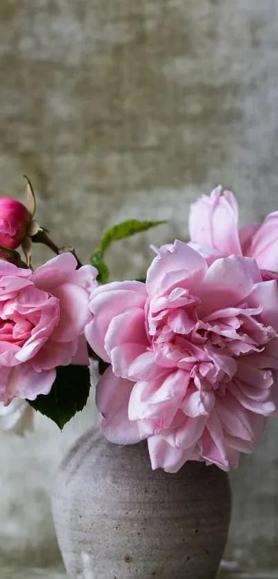 Elegant pink roses in a rustic vase against a textured background.