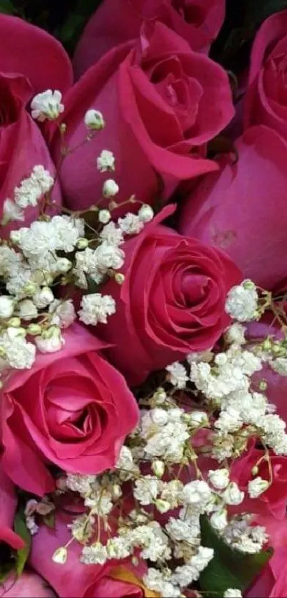 Elegant bouquet of pink roses with tiny white flowers.