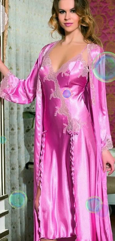 Elegant pink satin nightgown with lace details.