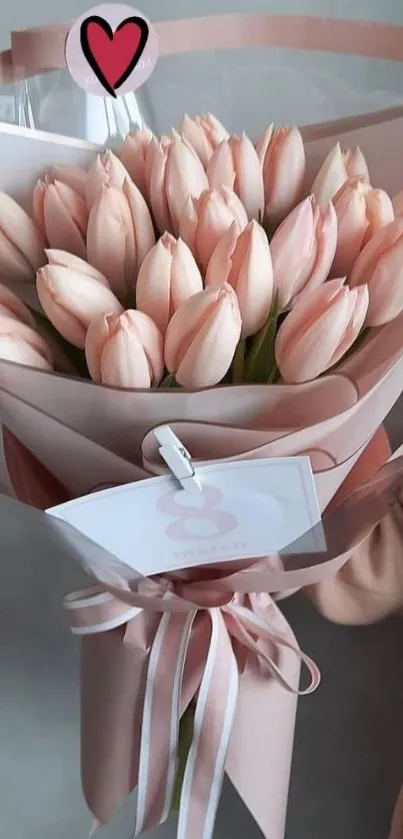 Delicate bouquet of soft pink tulips against a pastel background.