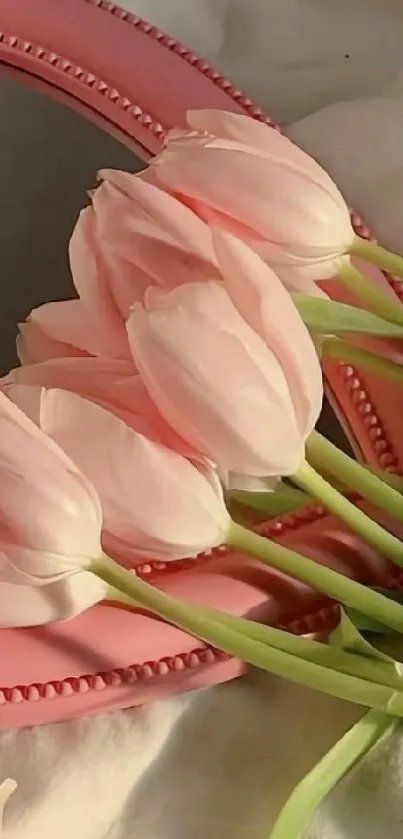 Pink tulips beautifully arranged on a pink border mirror.