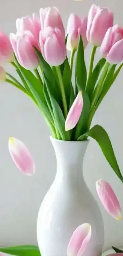 Elegant pink tulips in a white vase.