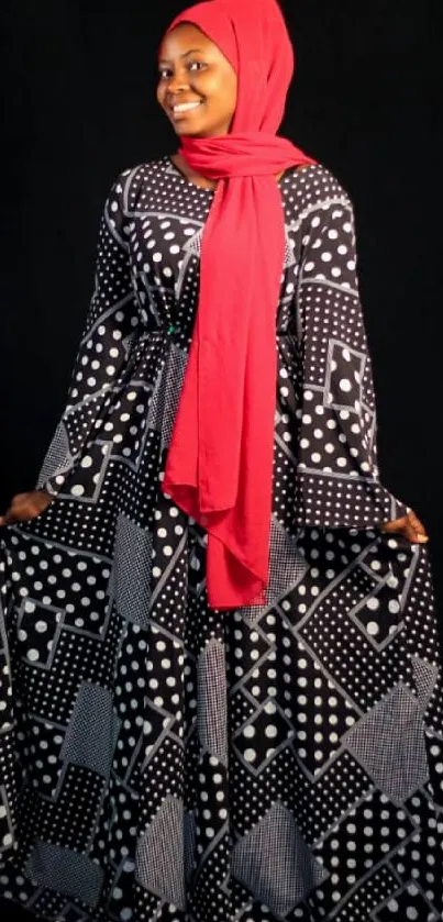 A woman in a polka dot dress with a red scarf on a black background.