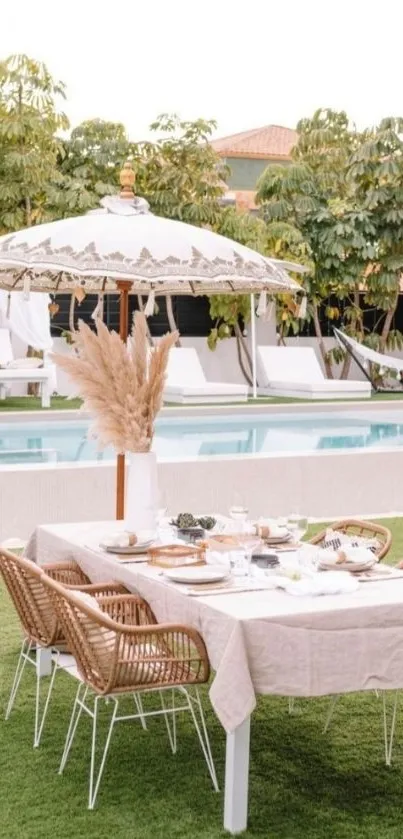 Elegant outdoor dining setup by a pool with rattan chairs and umbrella.