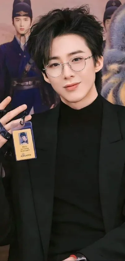 Stylish person with glasses in black outfit.