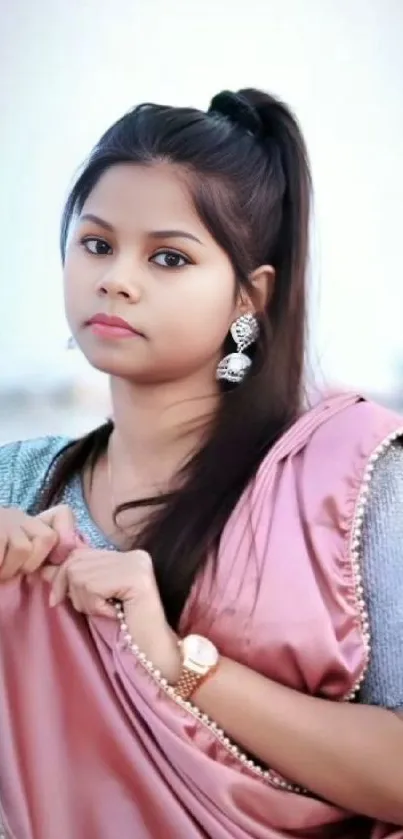 Elegant portrait of a young woman in traditional attire for phone wallpaper.