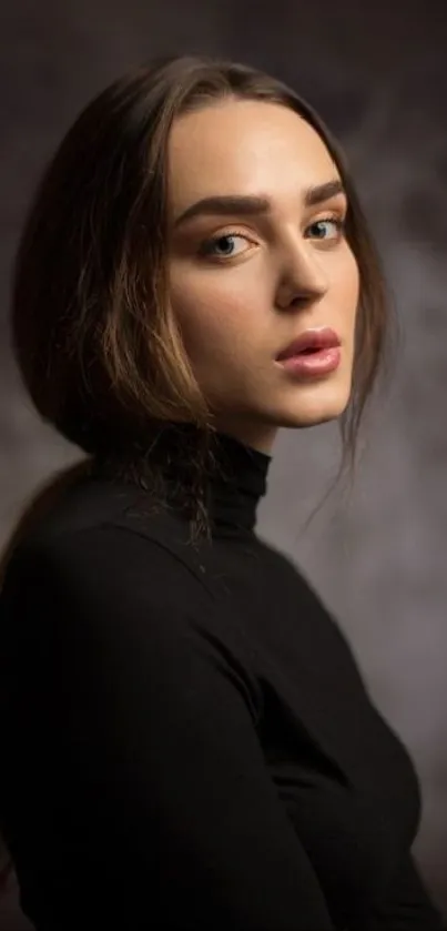 Elegant portrait of a woman in a black turtleneck with a moody background.