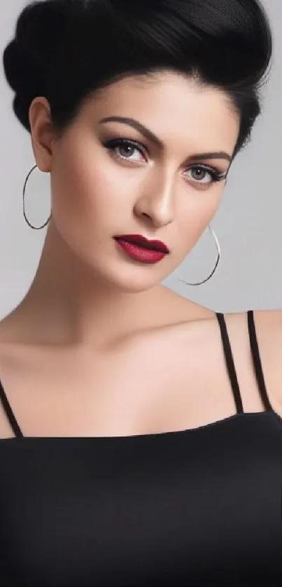 Elegant portrait of a woman with black dress and hoop earrings.