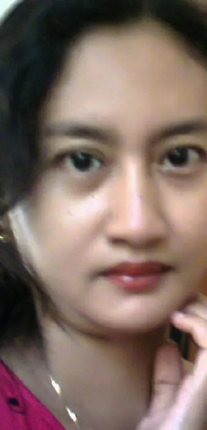 Elegant portrait of a woman with a calm expression.