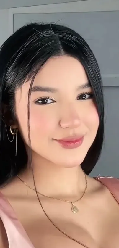 Elegant woman with soft smile posing.