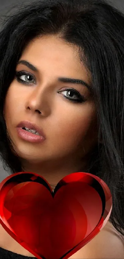 Elegant portrait with glossy red heart on a dark background.