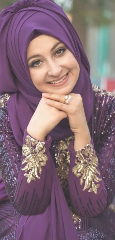 Woman in purple dress, smiling elegantly, with gold embroidery.