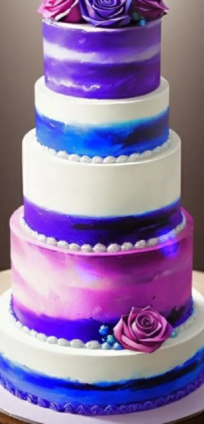 Elegant purple tiered cake with floral accents on a smooth backdrop.