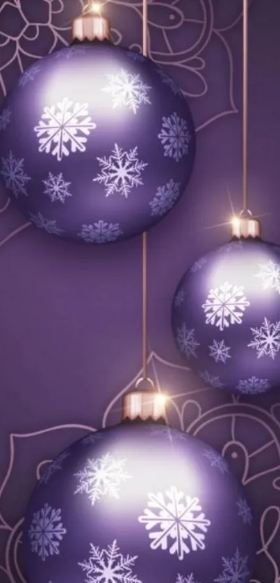 Purple Christmas ornaments with snowflakes for mobile wallpaper.