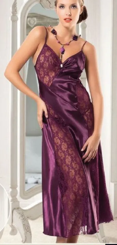 Woman in elegant purple evening gown with lace details.