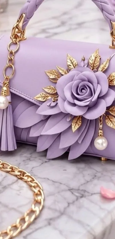 Lavender handbag with floral design and gold accents on marble surface.