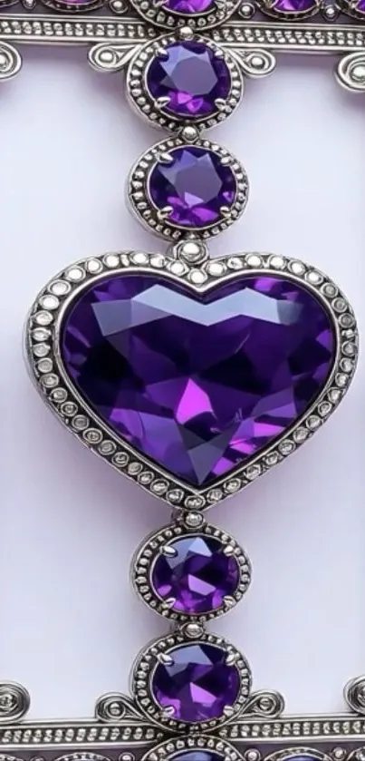 Purple gemstone heart with silver frame on wallpaper.
