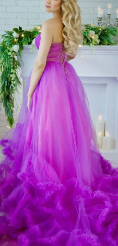 Woman in elegant purple gown with cascading fabric design.