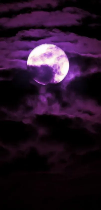 Purple moon behind clouds in night sky.