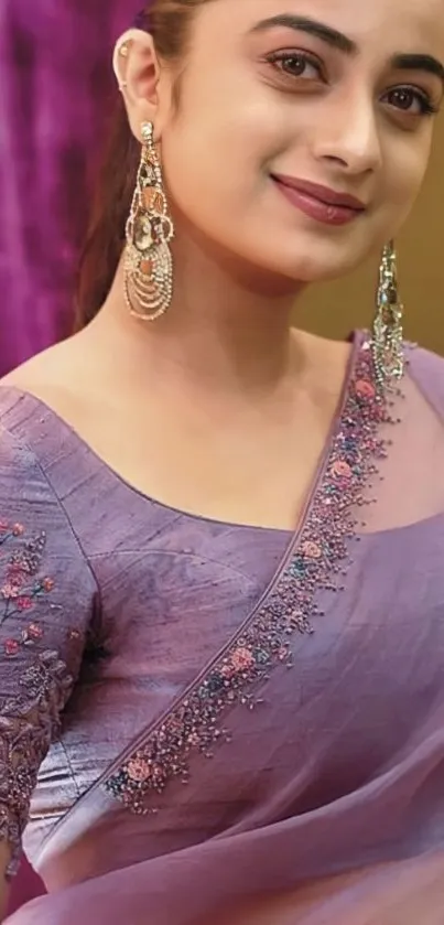 Woman in purple saree with earrings, elegant portrait.