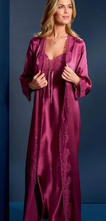 Woman in elegant purple satin robe against dark background.