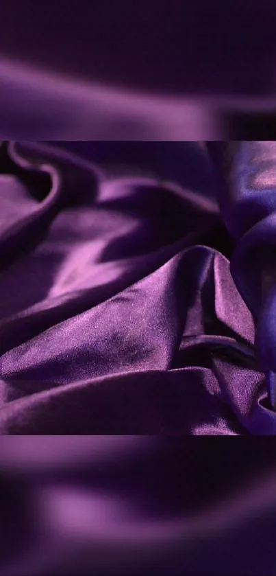 Elegant deep purple satin fabric wallpaper.