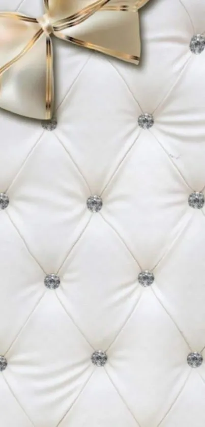 Elegant quilted mobile wallpaper with gold bow accent.